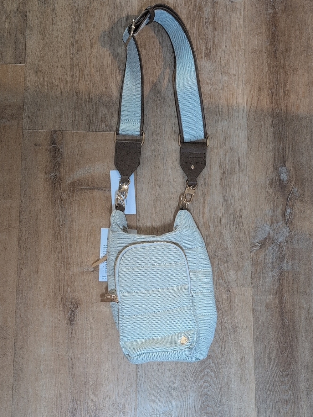 Wanderfull Hydro crossbody with brown strap and gold trim